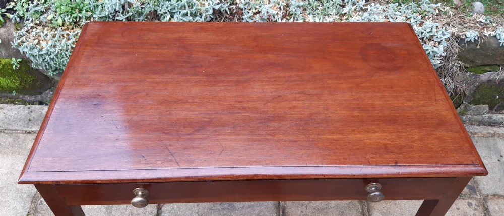A Georgian mahogany side table featuring a rectangular top, a single wide drawer with two turned wooden knobs, and four square tapered legs. View II