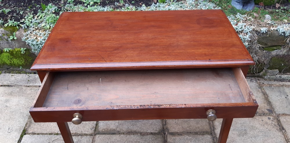 A Georgian mahogany side table featuring a rectangular top, a single wide drawer with two turned wooden knobs, and four square tapered legs. View VII