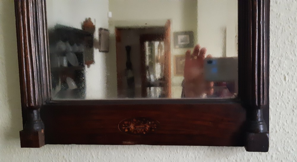 A tall dark oak wall mirror featuring fan marquetry inlay on the arched cresting and reeded side pilasters. View II