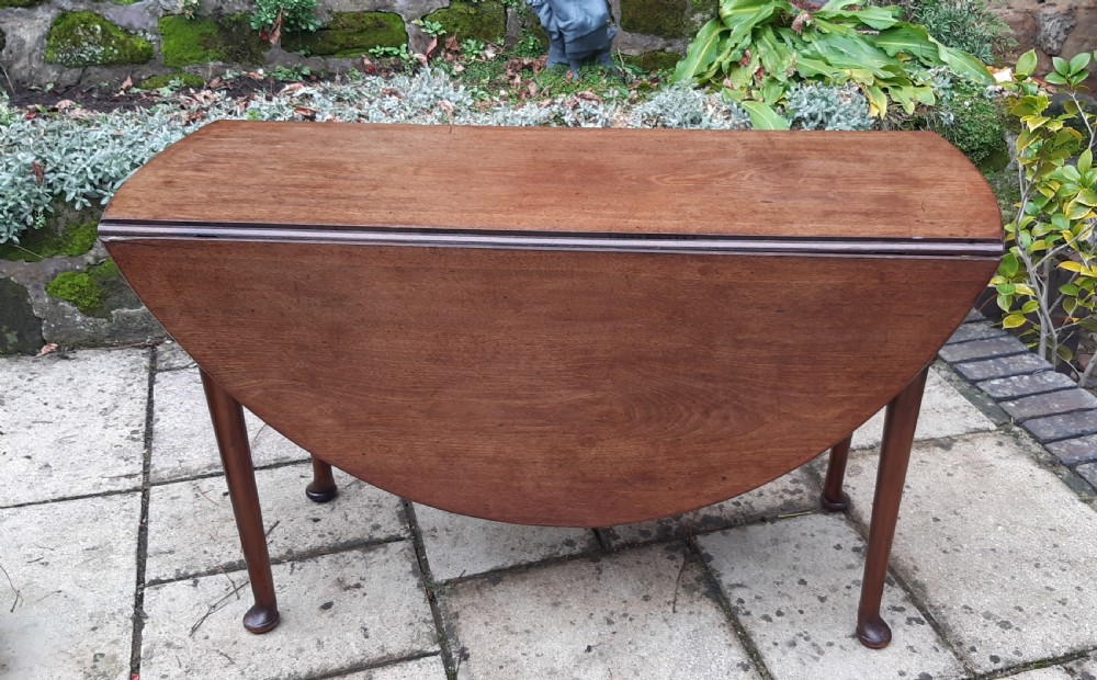 Georgian mahogany drop leaf dining table