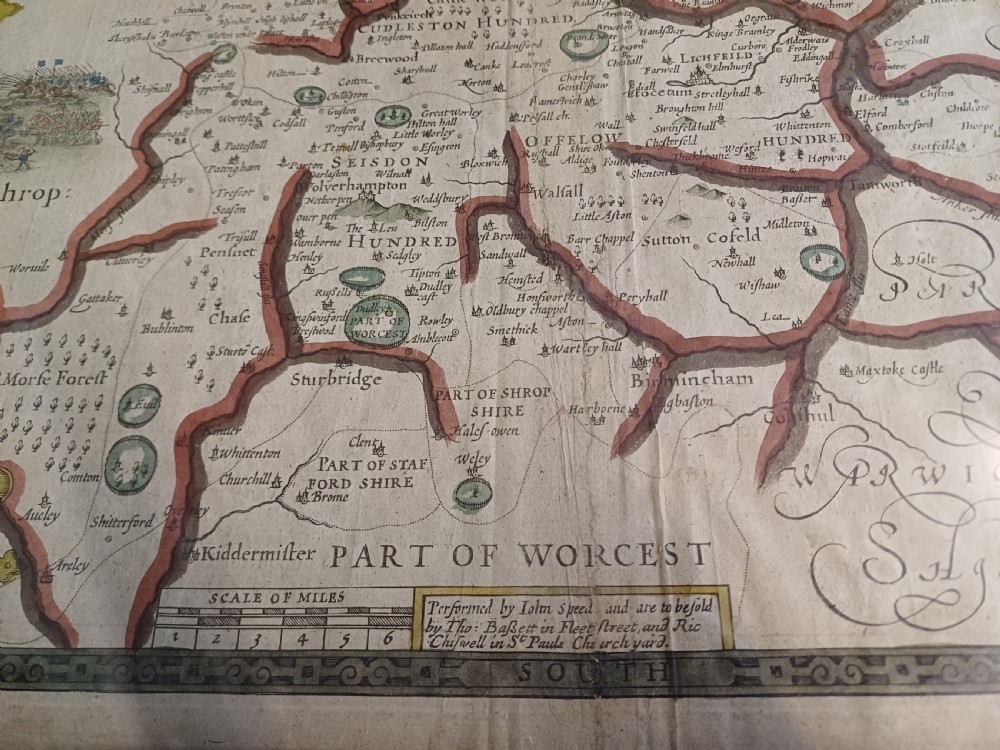Framed 17th-century hand-coloured engraved map of Staffordshire by John Speed featuring heraldic crests and inset town plans of Stafford and Lichfield. View V