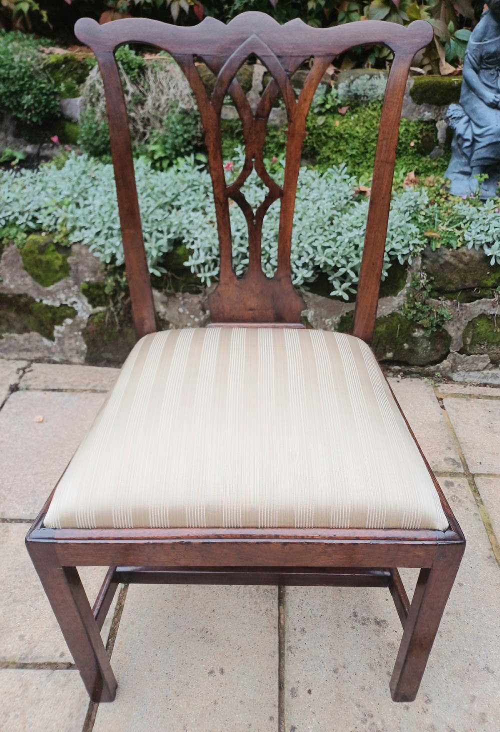 An 18th-century Chippendale mahogany side chair featuring a carved Gothic pierced splat back and a neutral striped fabric seat. View II