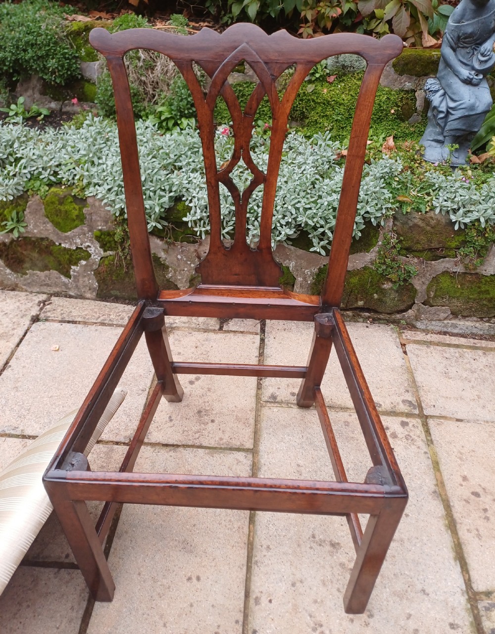 An 18th-century Chippendale mahogany side chair featuring a carved Gothic pierced splat back and a neutral striped fabric seat. View III