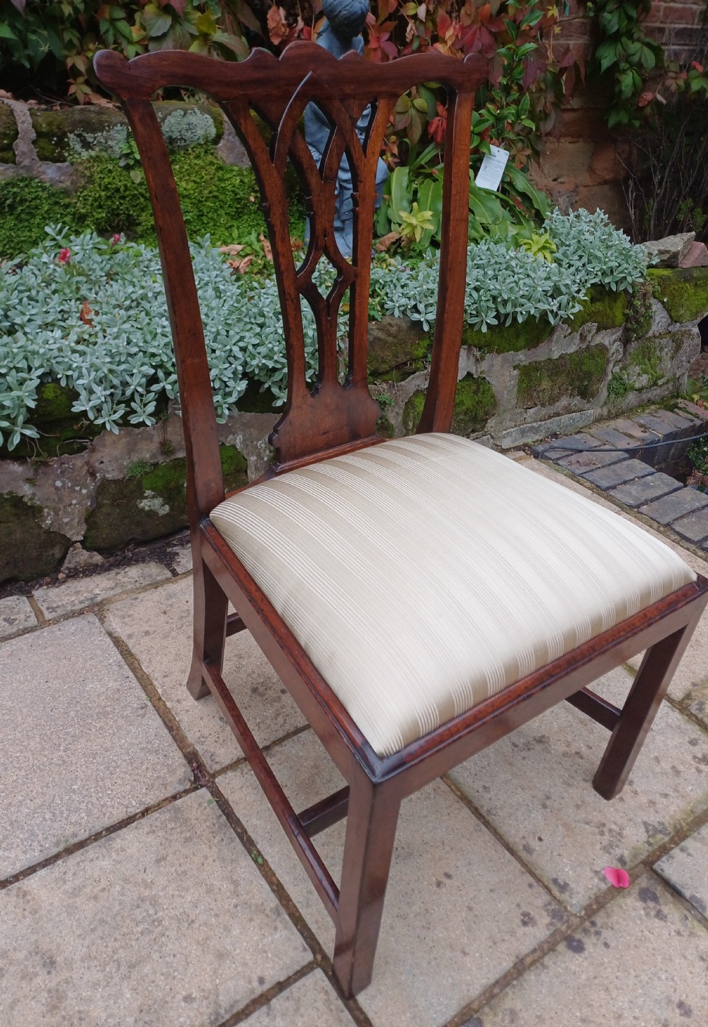 An 18th-century Chippendale mahogany side chair featuring a carved Gothic pierced splat back and a neutral striped fabric seat. View V