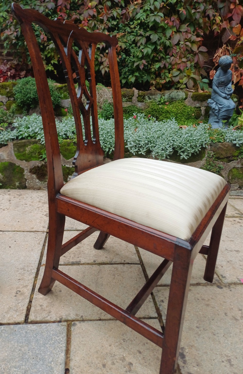 An 18th-century Chippendale mahogany side chair featuring a carved Gothic pierced splat back and a neutral striped fabric seat. View VI