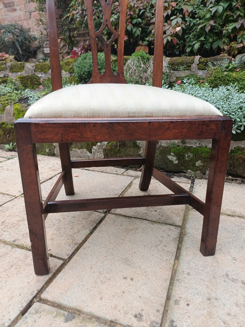 An 18th-century Chippendale mahogany side chair featuring a carved Gothic pierced splat back and a neutral striped fabric seat. View VII