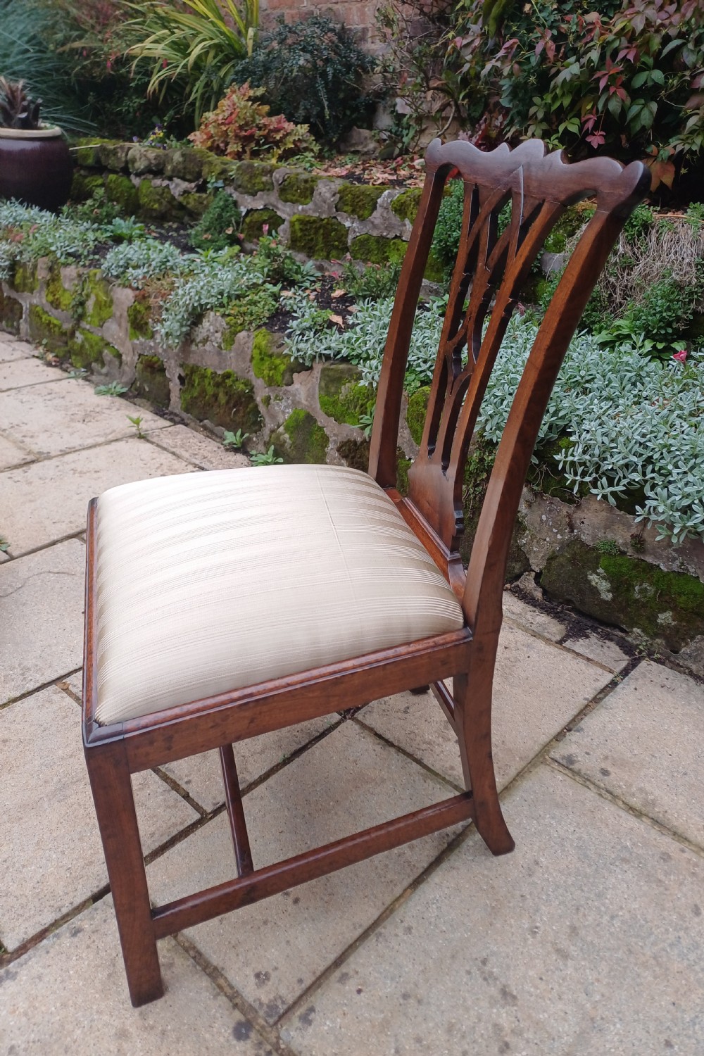 An 18th-century Chippendale mahogany side chair featuring a carved Gothic pierced splat back and a neutral striped fabric seat. View VIII