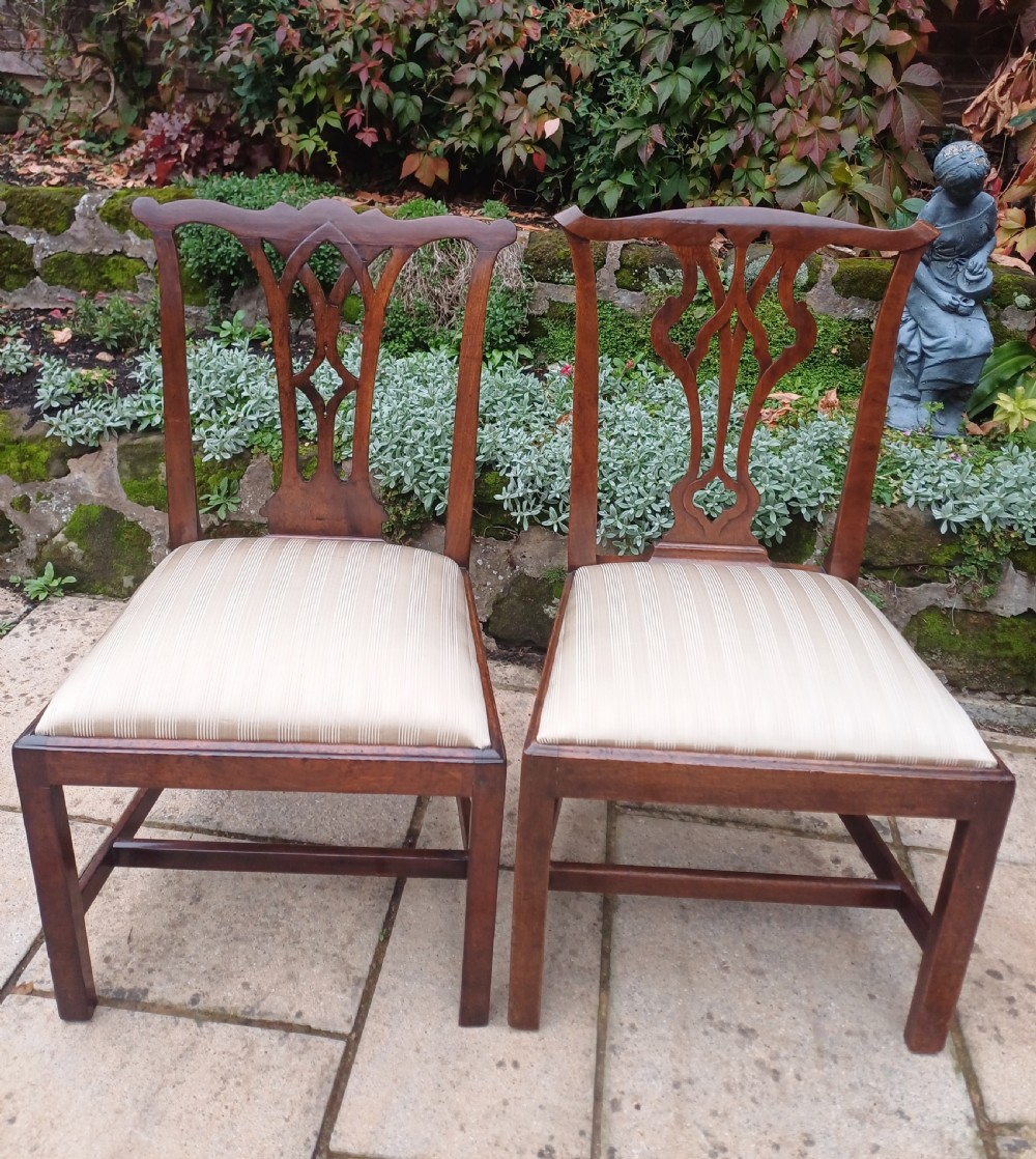 An 18th-century Chippendale mahogany side chair featuring a carved Gothic pierced splat back and a neutral striped fabric seat. View IX