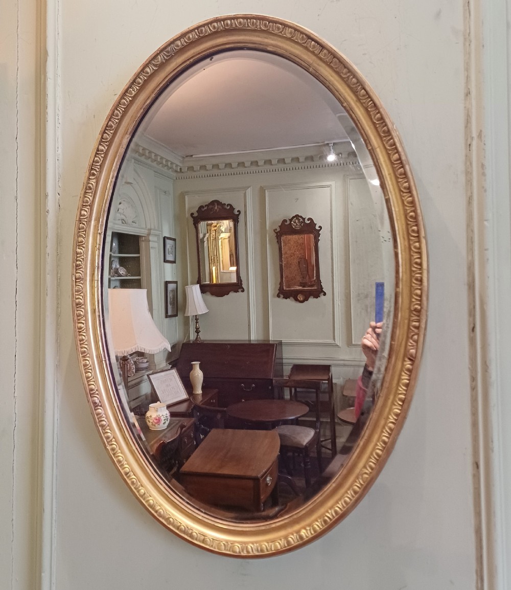 Oval giltwood gilt mirror