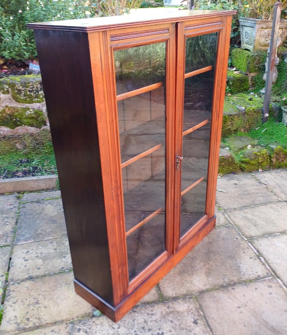 Edwardian walnut glazed bookcase  View II
