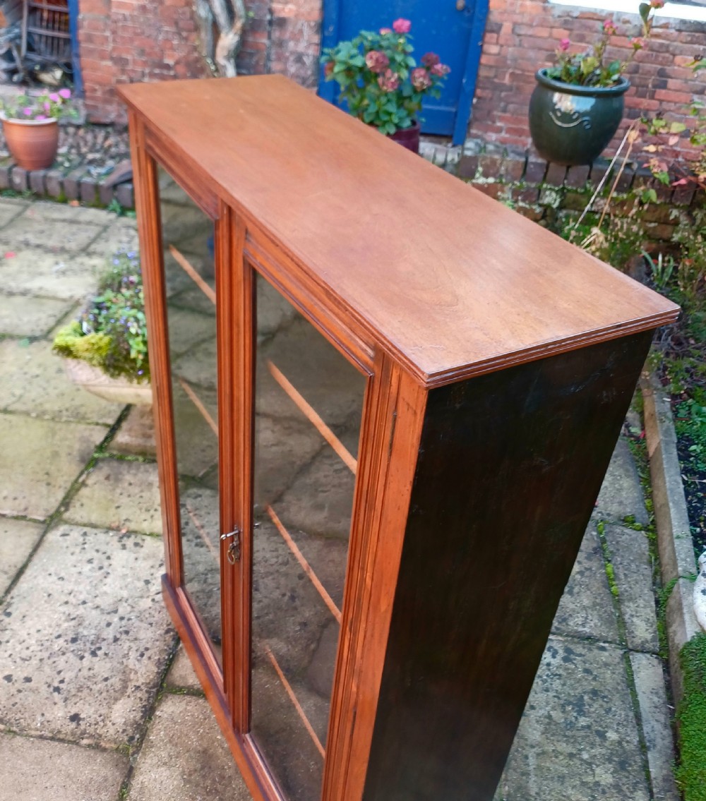 Edwardian walnut glazed bookcase  View VII