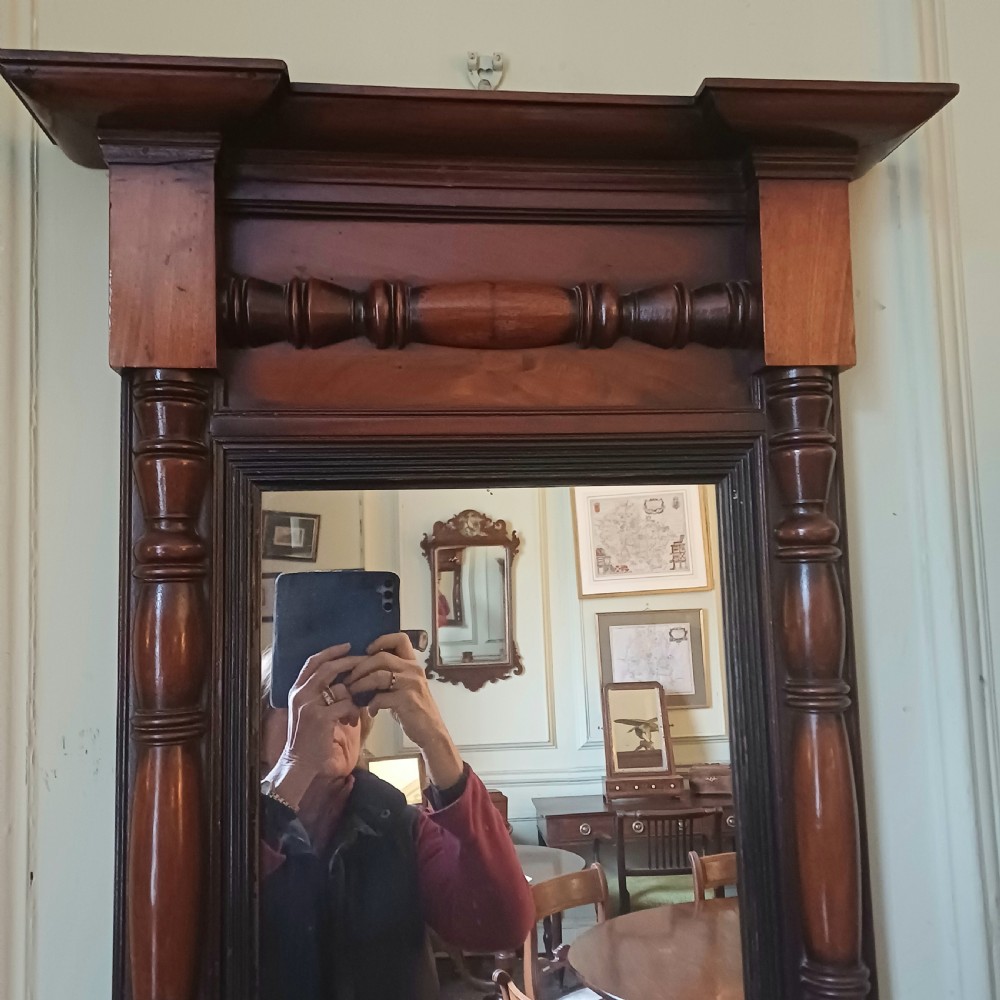A 19th-century rectangular mahogany wall pier mirror with an architectural corniced top, decorative turned columns, and central spindle details. View III