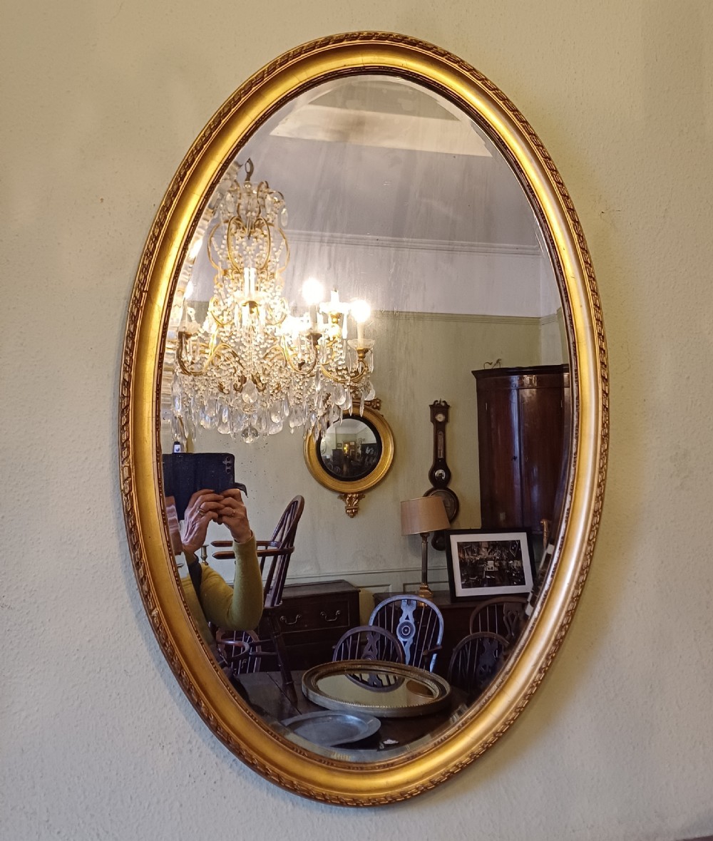 Large oval gilt mirror 19th century  View II
