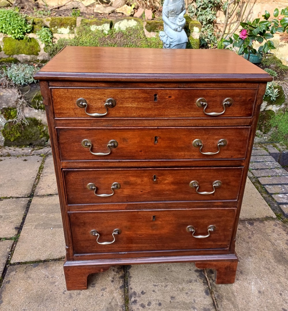 A very small mahogany chest of drawers
