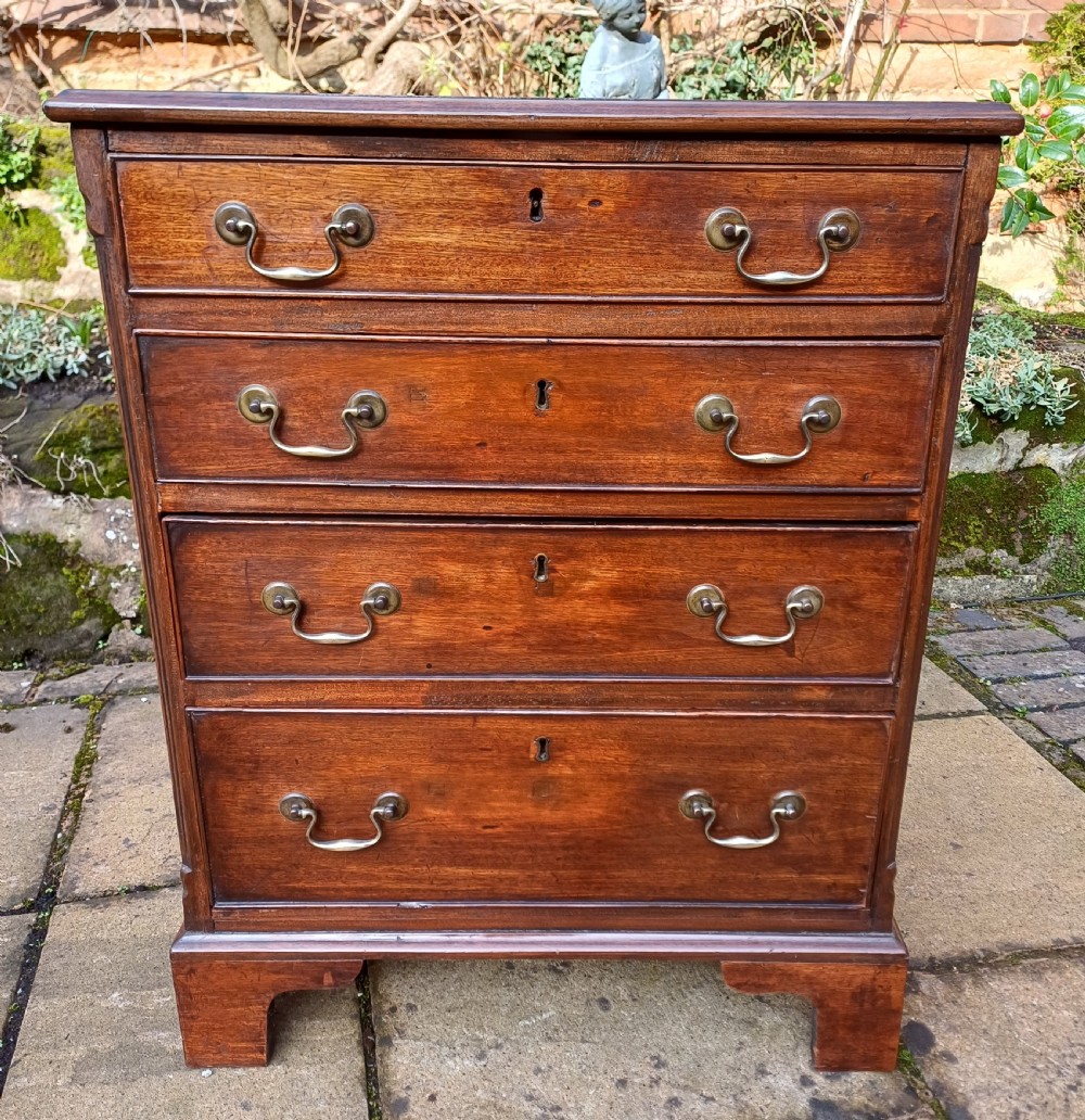 A very small mahogany chest of drawers View II