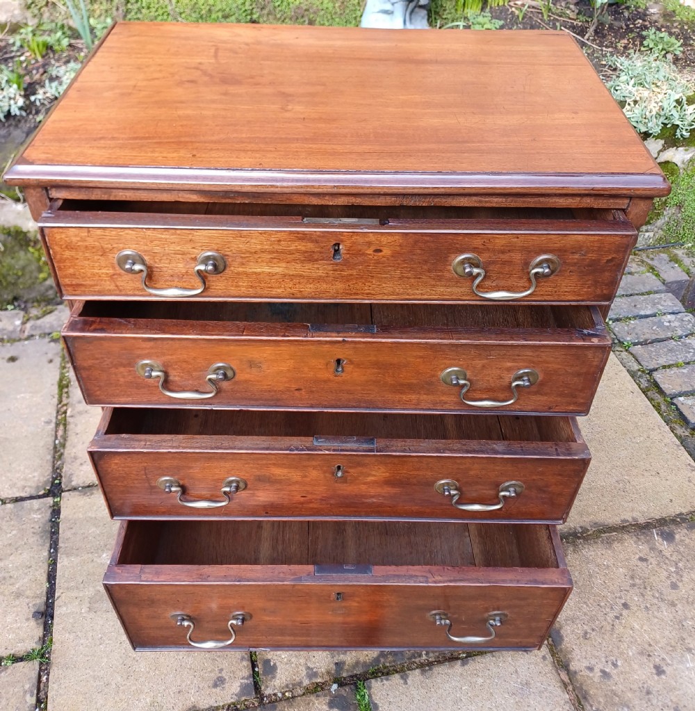 A very small mahogany chest of drawers View VIII