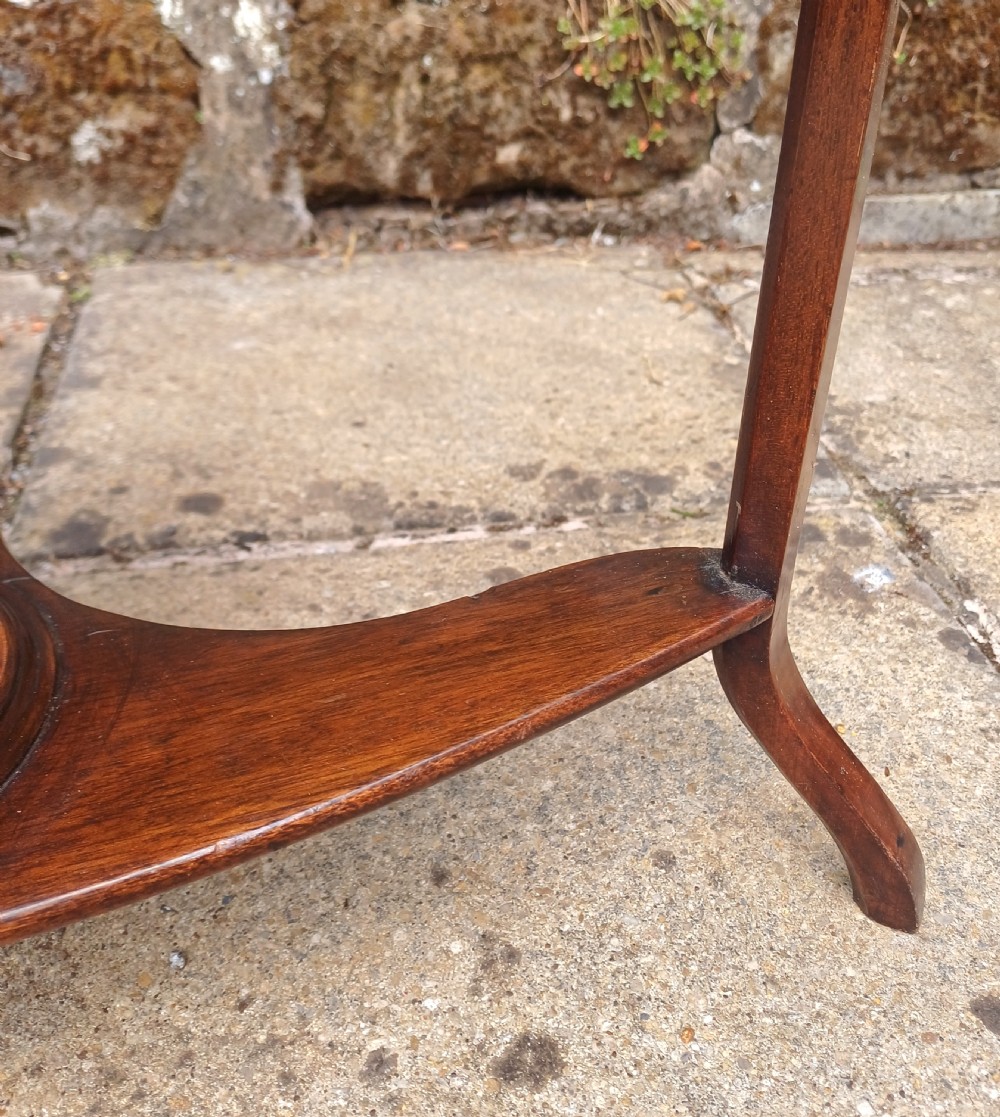 A Georgian mahogany corner washstand featuring a curved splashback, middle drawer with brass handles, and lower stretcher with a basin ring. View IX