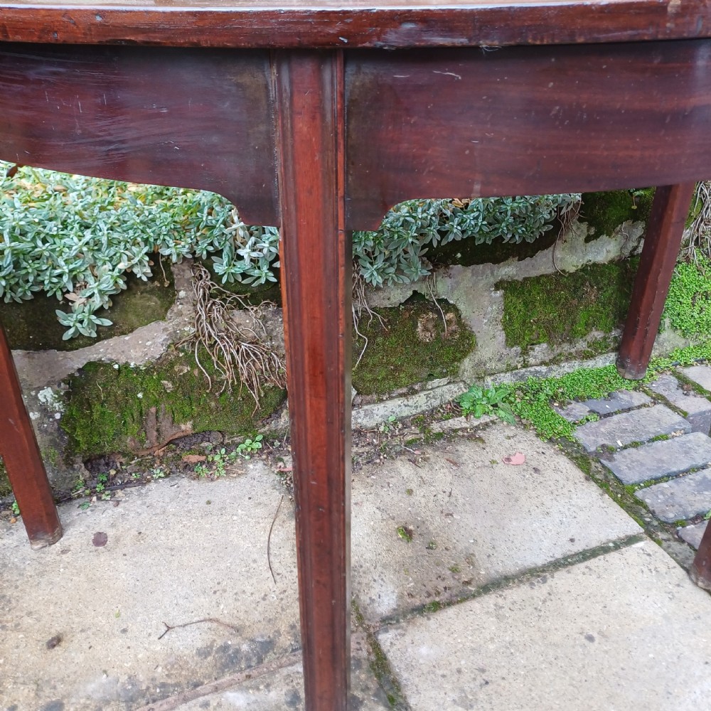 A pair of Georgian mahogany demi-lune tables with semi-circular tops and straight tapered legs. View VIII