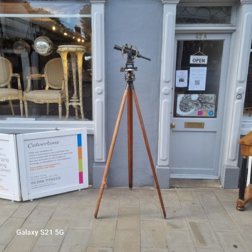fig 2. A 19th-century patinated brass vernier theodolite featuring a mounted optical telescope, spirit level, and calibrated circular scale.