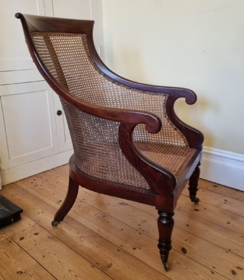 AN ANTIQUE MAHOGANY BERGRE LIBRARY CHAIR - ADDITIONAL PHOTO 1