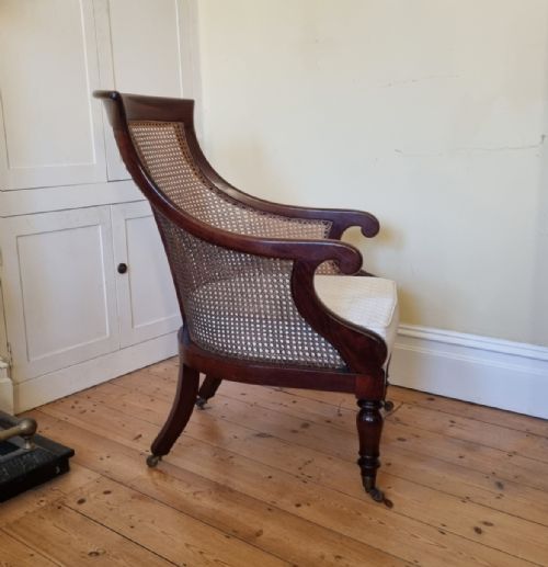 AN ANTIQUE MAHOGANY BERGRE LIBRARY CHAIR - ADDITIONAL PHOTO 3