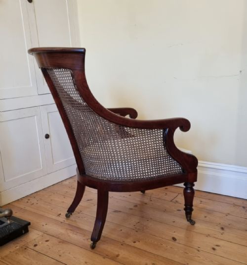 AN ANTIQUE MAHOGANY BERGRE LIBRARY CHAIR - ADDITIONAL PHOTO 4