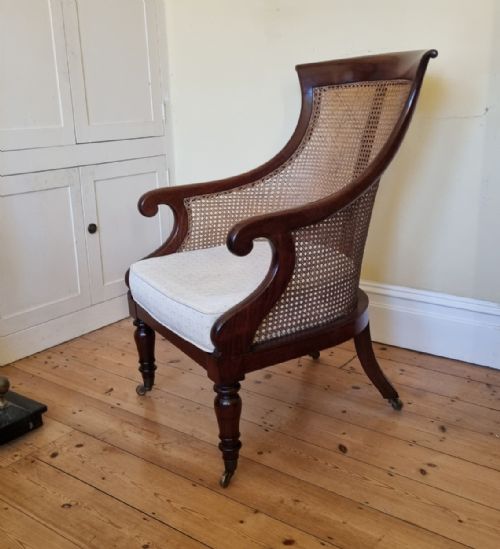 AN ANTIQUE MAHOGANY BERGRE LIBRARY CHAIR - ADDITIONAL PHOTO 8