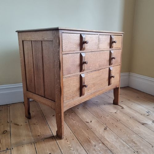 a 1930s oak chest of drawers in the manner of the cotswold school - CATEGORY: ANTIQUE CHEST OF DRAWERS - DATED 1920