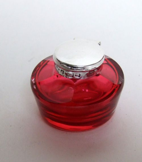 A Charming Early Victorian Silver and Cranberry Ink Bottle.