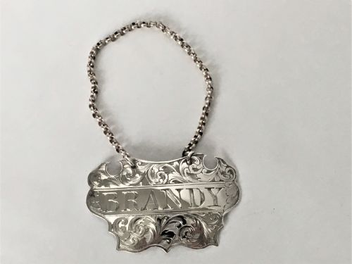 A Victorian Silver Escutcheon Brandy Decanter Label