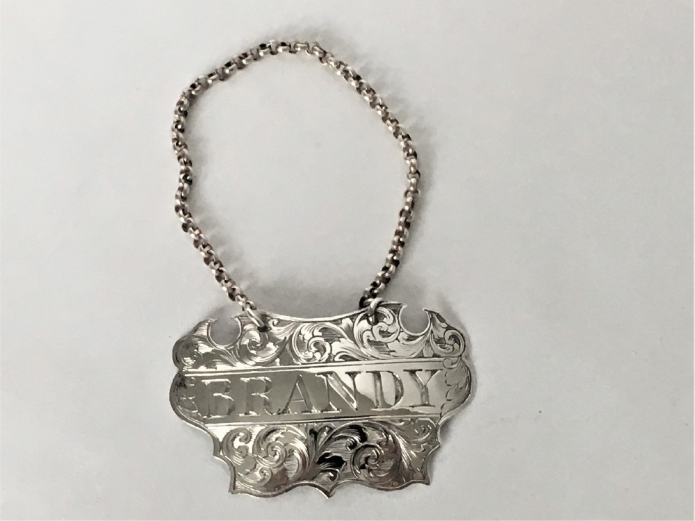A Victorian silver escutcheon Brandy decanter label