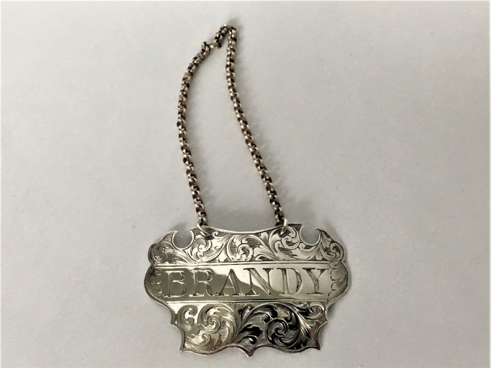 A Victorian silver escutcheon Brandy decanter label View II