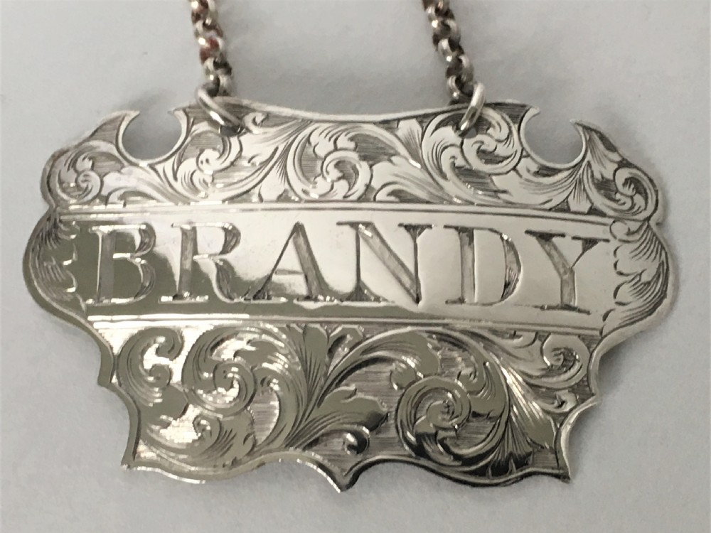 A Victorian silver escutcheon Brandy decanter label View III