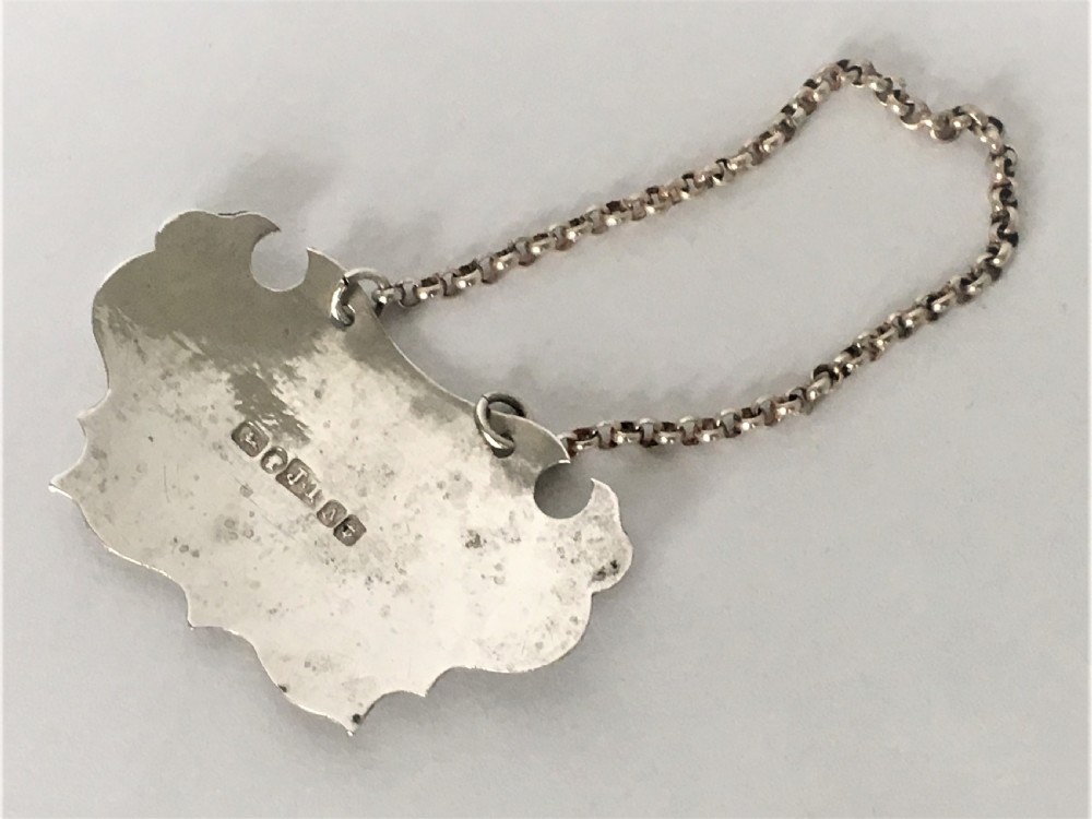 A Victorian silver escutcheon Brandy decanter label View IV