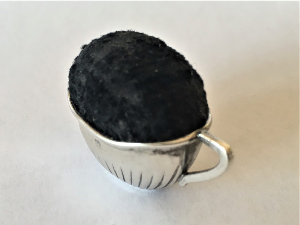 A  novelty Edwardian silver pin cushion View III