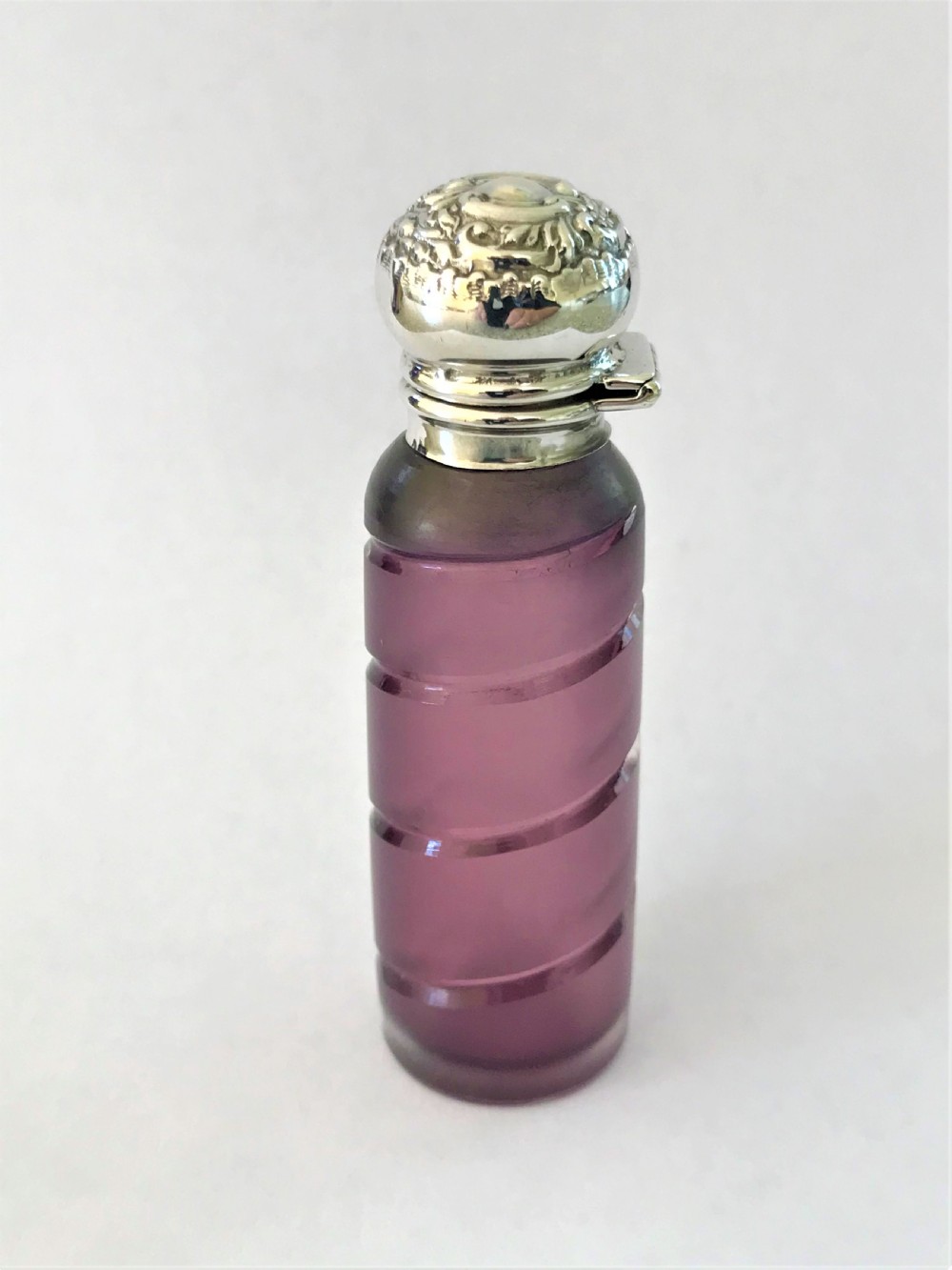 A lovely Edwardian silver mounted amethyst scent bottle