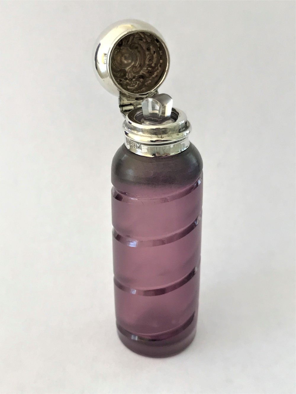 A lovely Edwardian silver mounted amethyst scent bottle View III