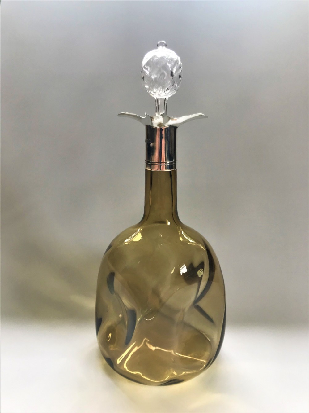 An unusual Victorian silver mounted decanter