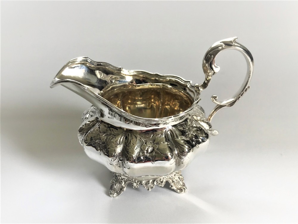 A fabulous William IV silver gilt cream jug View II
