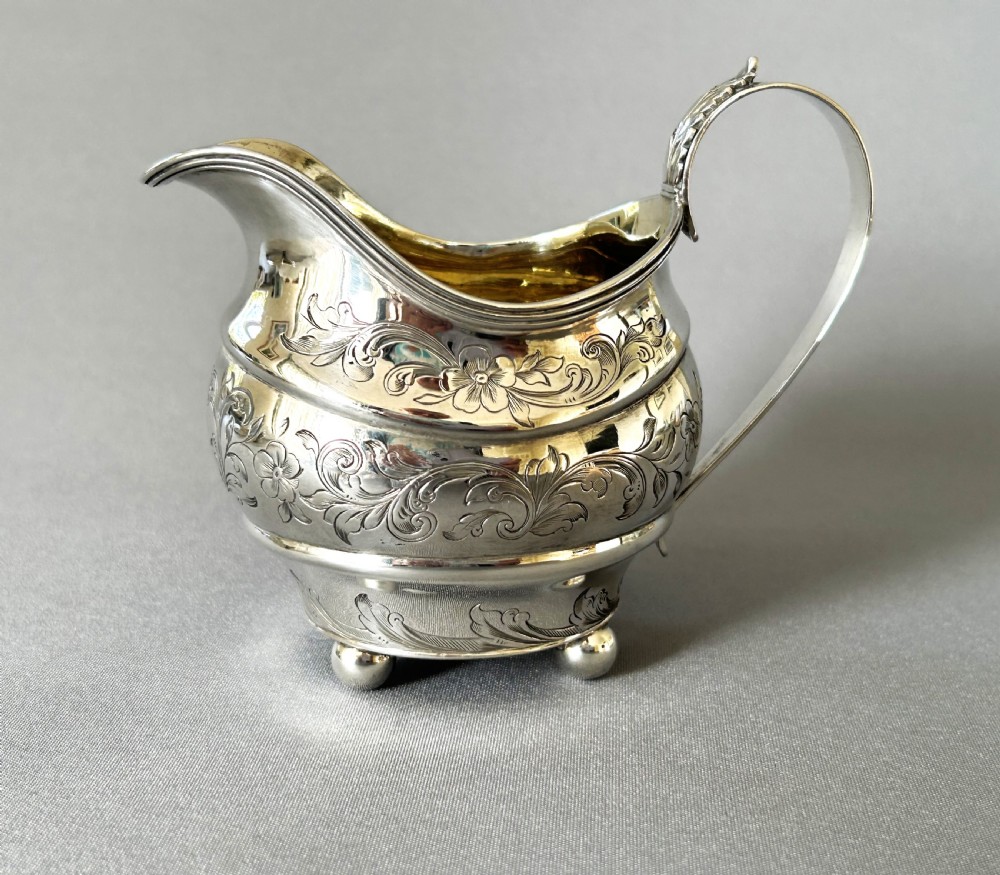 A lovely silver gilt Georgian cream jug View III