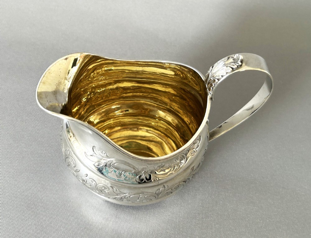 A lovely silver gilt Georgian cream jug View IV