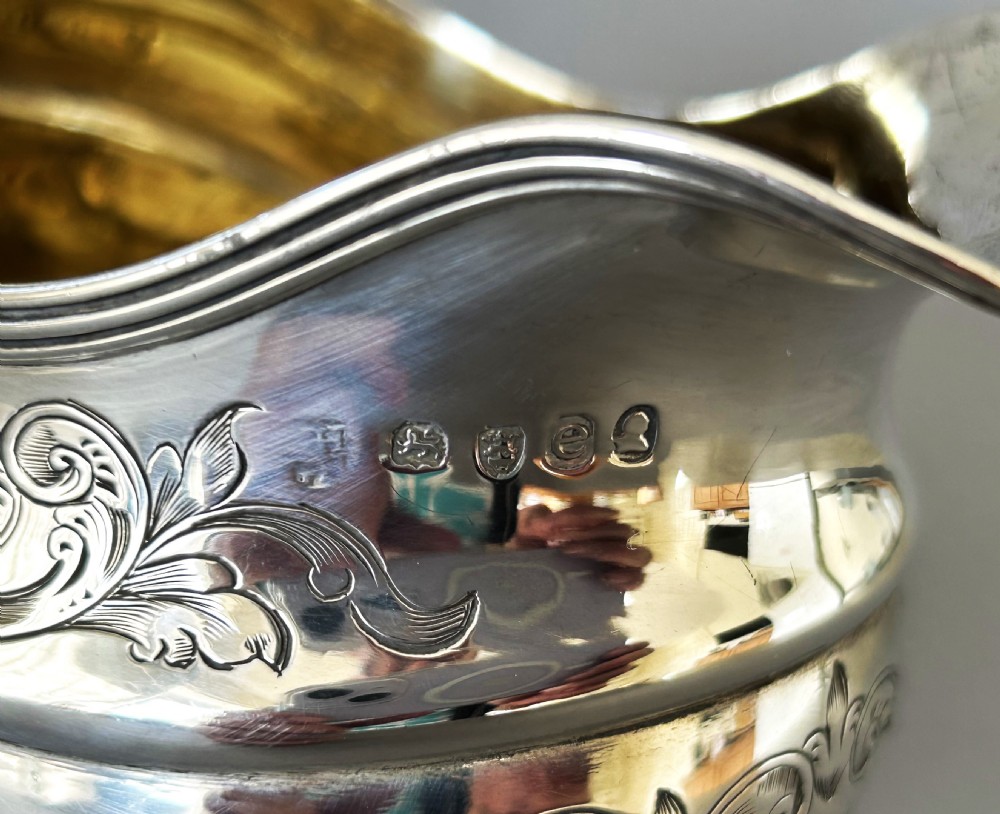 A lovely silver gilt Georgian cream jug View VI
