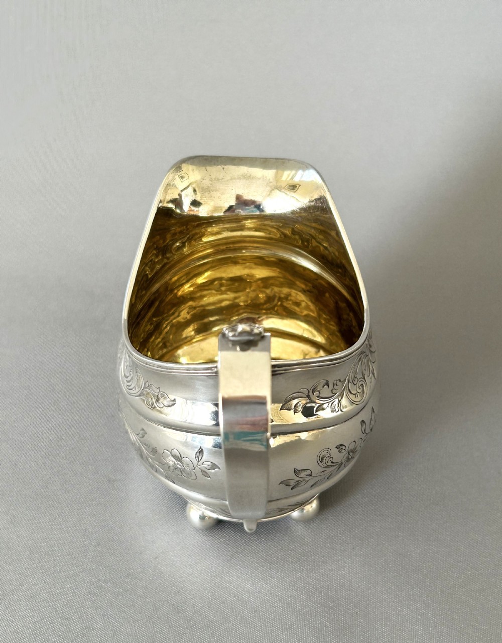 A lovely silver gilt Georgian cream jug View VII