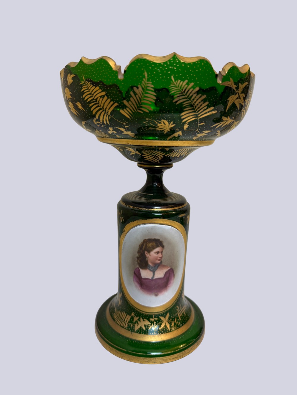 A three-piece emerald green Bohemian glass garniture set featuring gold gilt leaf patterns and oval enamel painted lady portraits. View IV