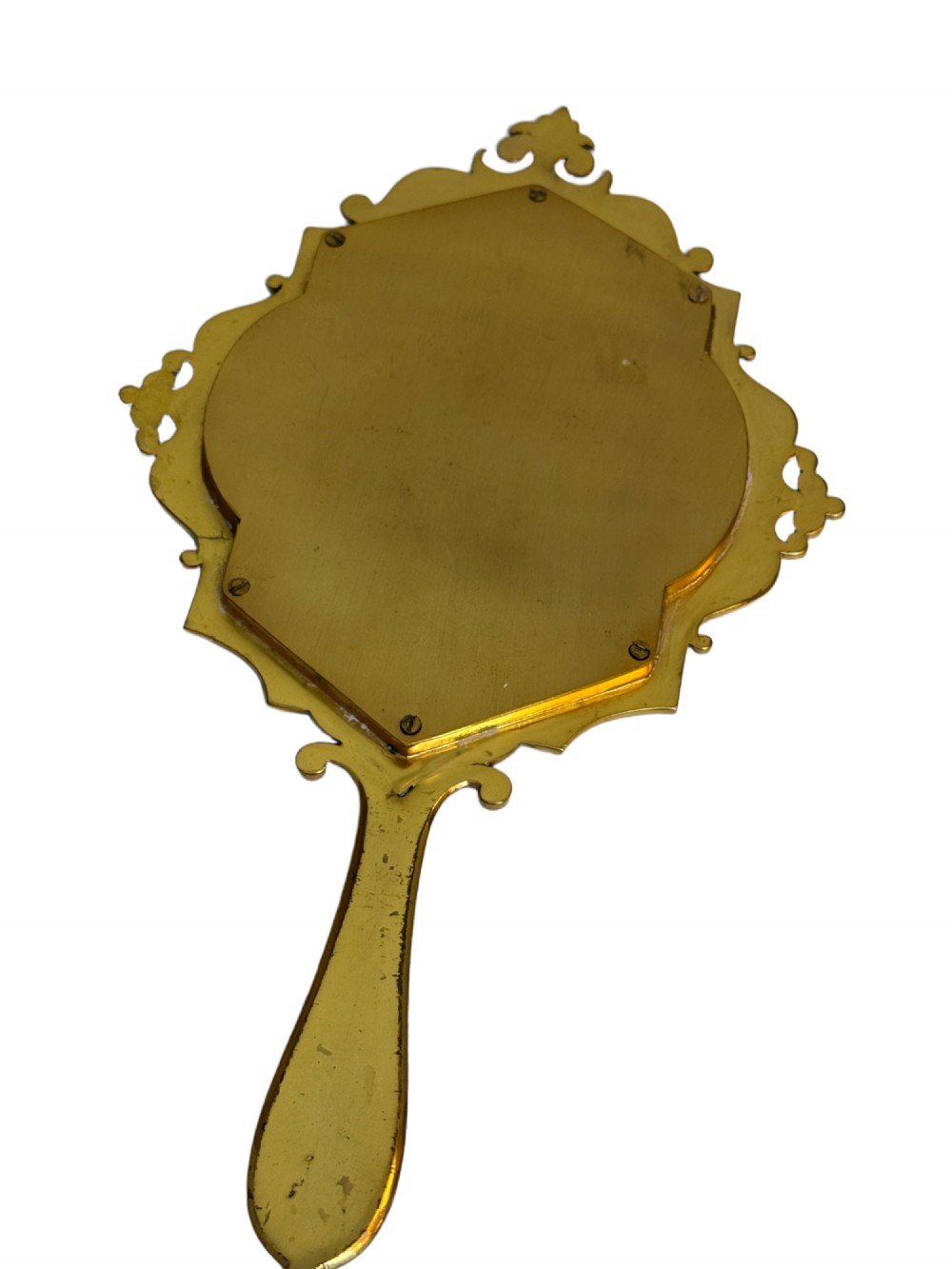 A 19th-century French gilt bronze and champleve enamel picture frame resting alongside a matching hand mirror with colourful floral motifs. View III