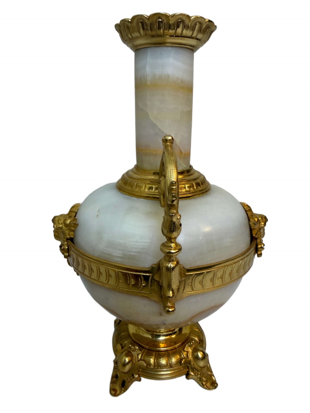 A pair of 19th-century French vases constructed from cream white veined onyx with ornate gilt bronze handles, winged cherub mounts, and footed bases. View VI