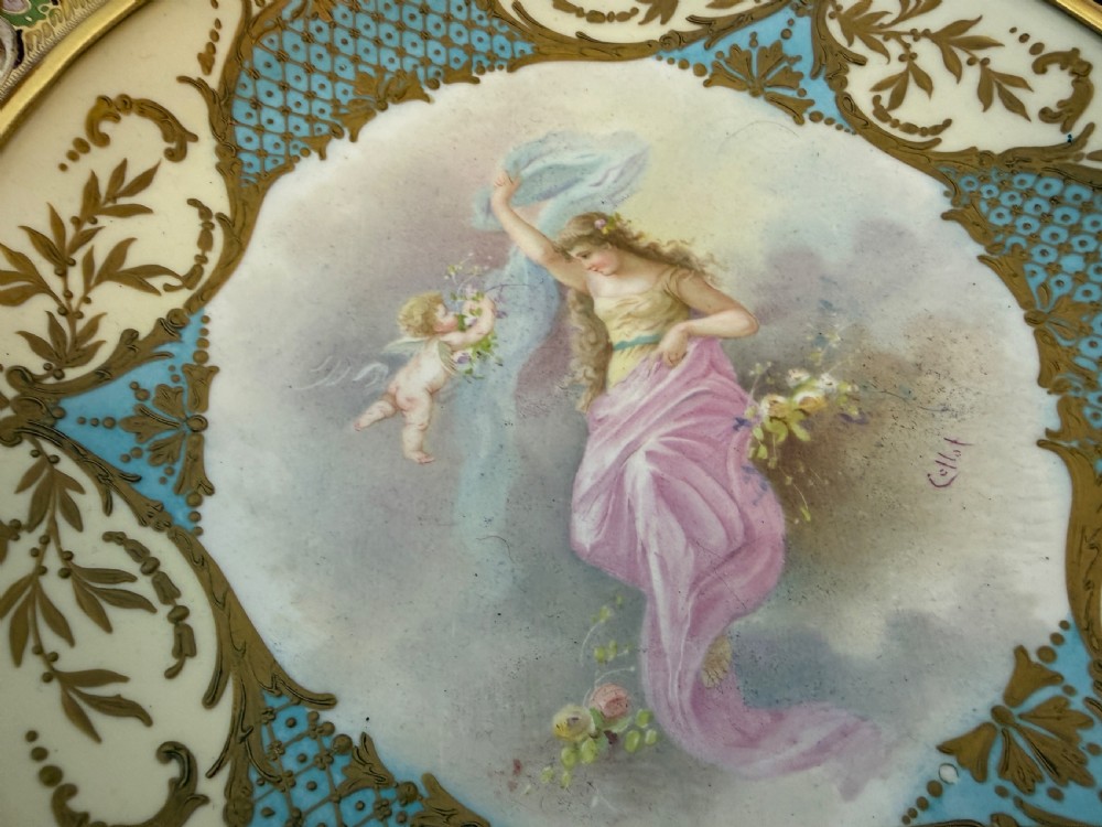A circular 19th-century French porcelain centrepiece with hand-painted classical figures framed by colourful champleve enamel and twin gilt bronze handles. View II