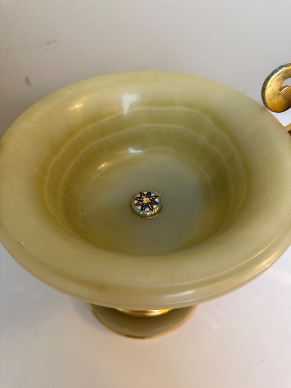 A 19th-century French green onyx centrepiece bowl on a pedestal base featuring twin scroll handles decorated with champleve enamel and gilt bronze mounts. View II