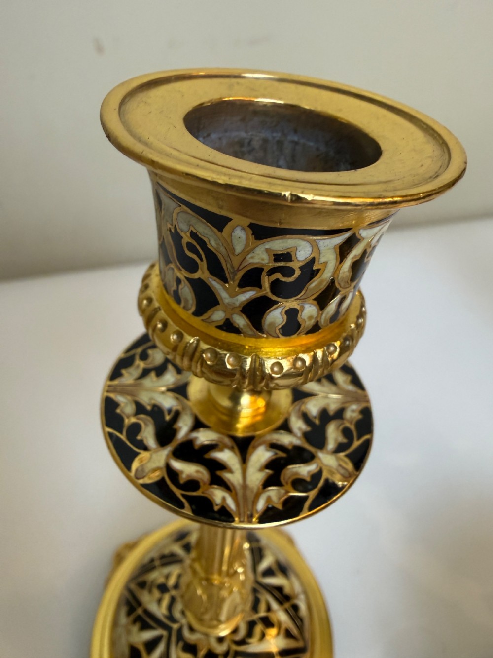 A nineteenth-century French writing set featuring a covered central inkwell flanked by two matching gilt bronze and champleve enamel candlesticks. View III