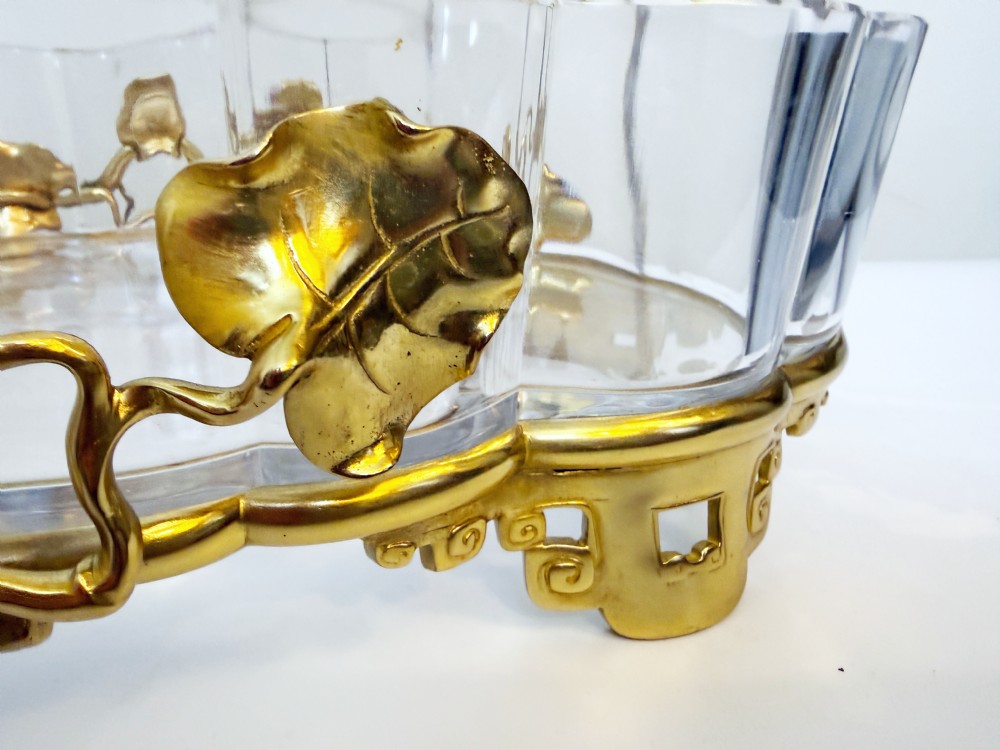 An oval crystal bowl set in an Art Nouveau gilt bronze frame adorned with sculpted leaves and organic vines. View V